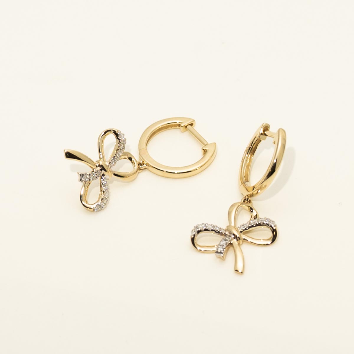 Diamond Bow Earrings in 14kt Yellow Gold (1/7ct tw)