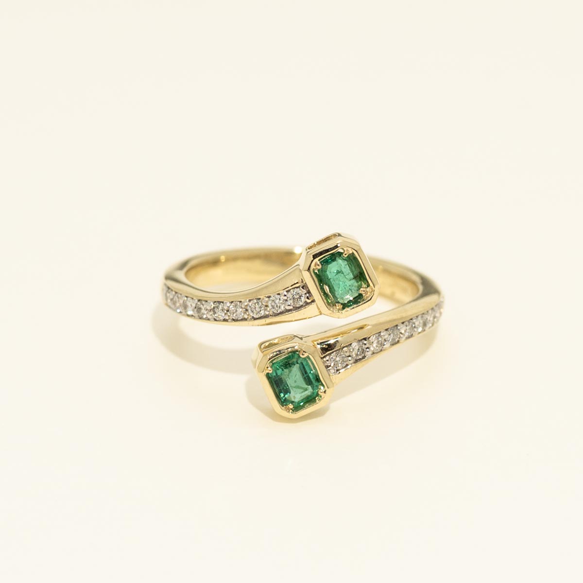 Two Stone Emerald and Diamond Bypass Ring in 14kt Yellow Gold (1/5ct tw)