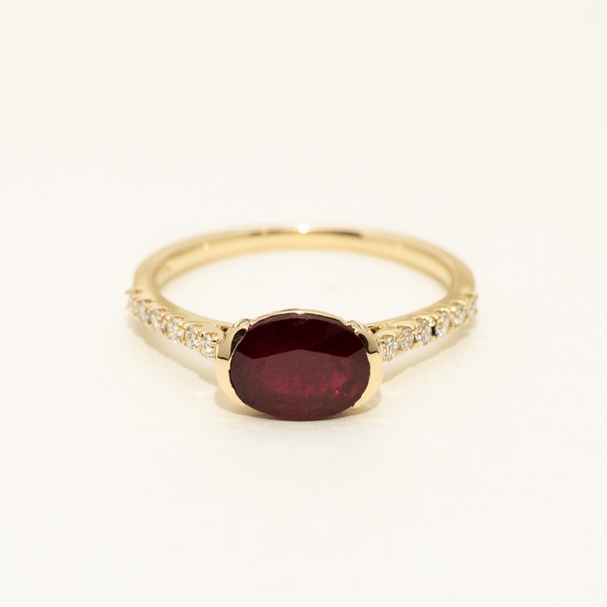 Oval Ruby East West Ring in 14kt Yellow Gold with Diamonds (1/7ct tw)