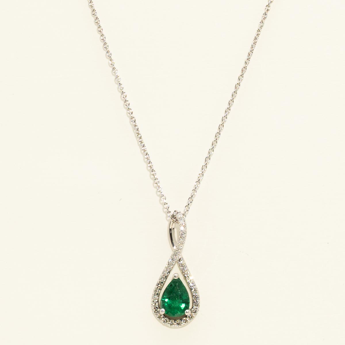 Pear Shaped Emerald Halo Necklace in 14kt White Gold with Diamonds (1/7ct tw)