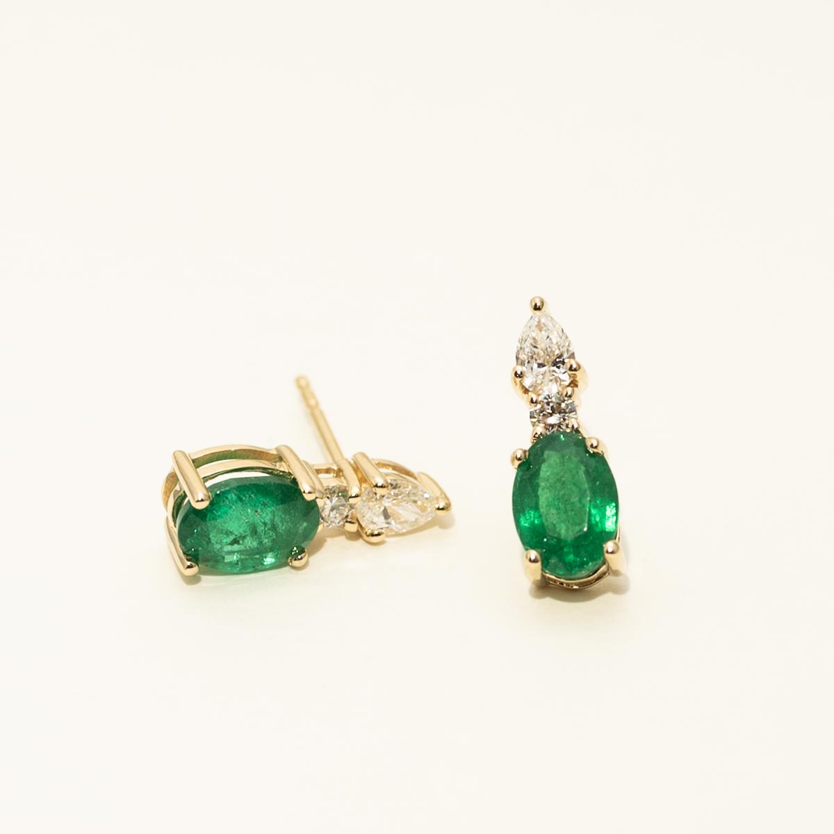 Oval Emerald Earrings in 14kt Yellow Gold with Diamonds (1/3ct tw)