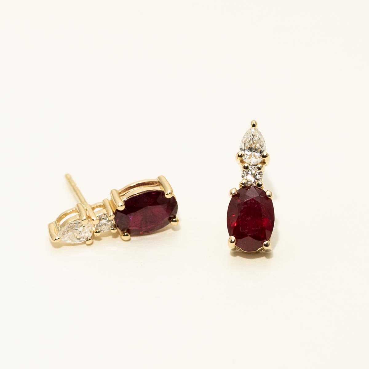 Oval Ruby Earrings in 14kt Yellow Gold with Diamonds (1/3ct tw)