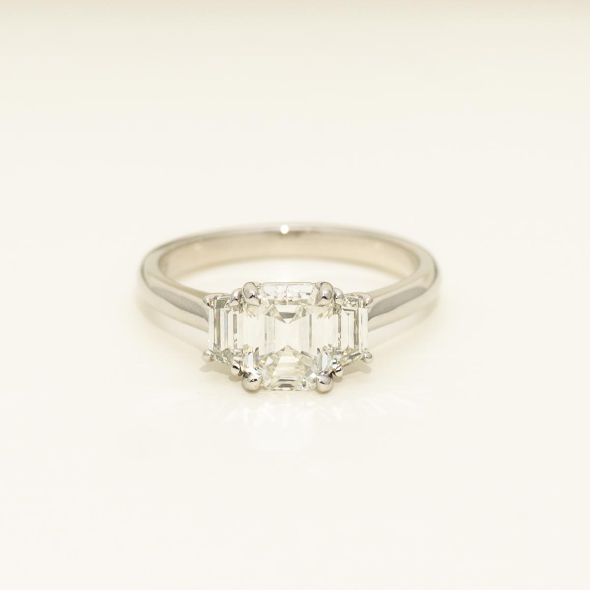 Emerald and Trapezoid Three Stone Diamond Engagement Ring in Platinum (1 7/8ct tw)