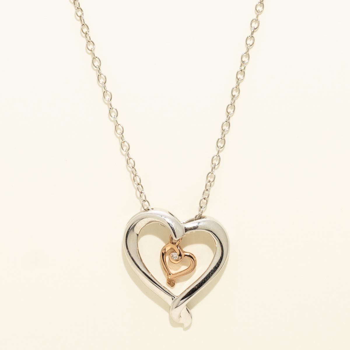 Heart Necklace in Sterling Silver and 10kt Rose Gold with Diamonds (.01ct tw)