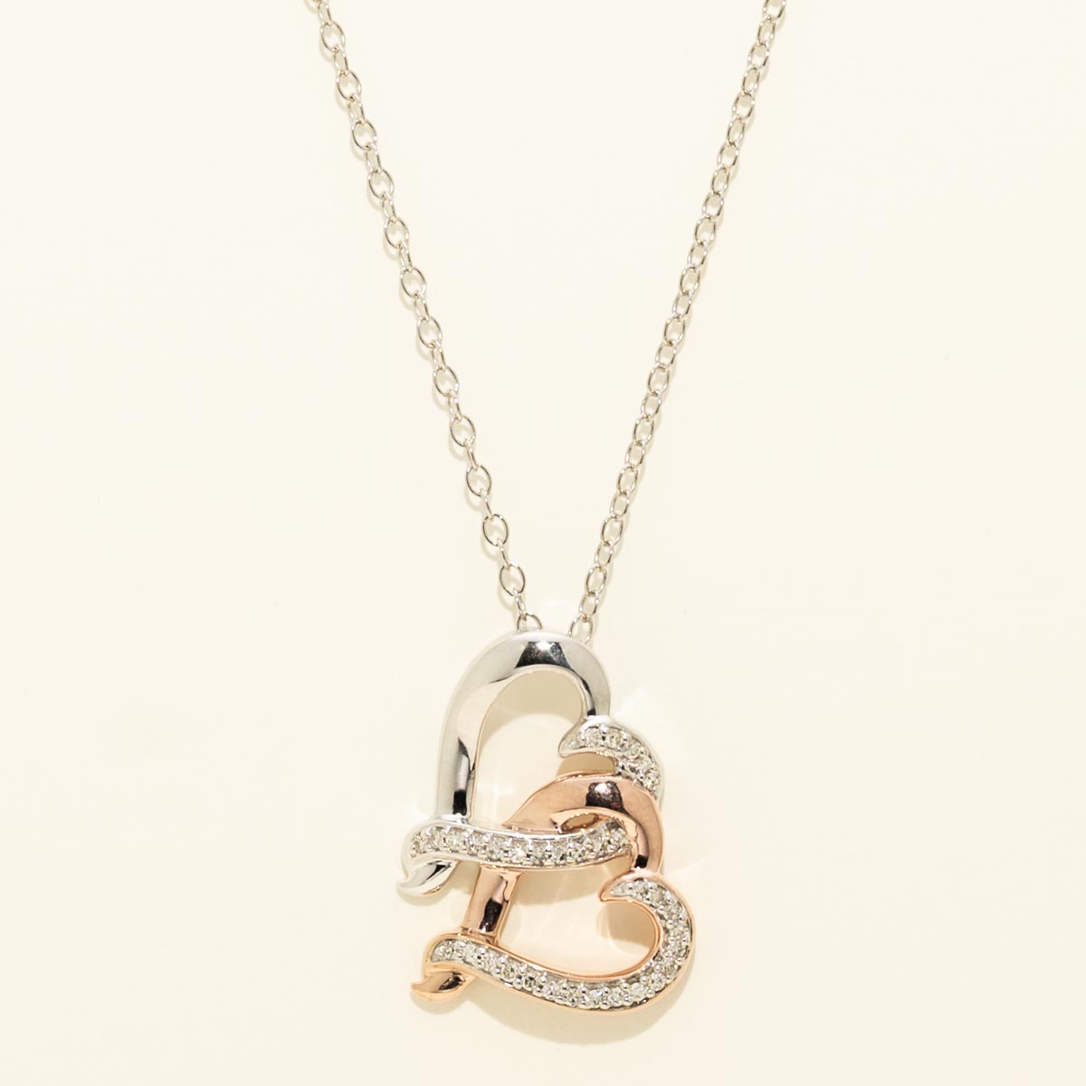 Diamond Double Heart Necklace in Sterling Silver and Rose Gold Plate (1/10ct tw)