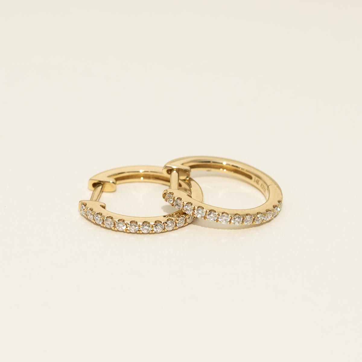 Diamond Huggie Hoop Earrings in 14kt Yellow Gold (1/4ct tw)