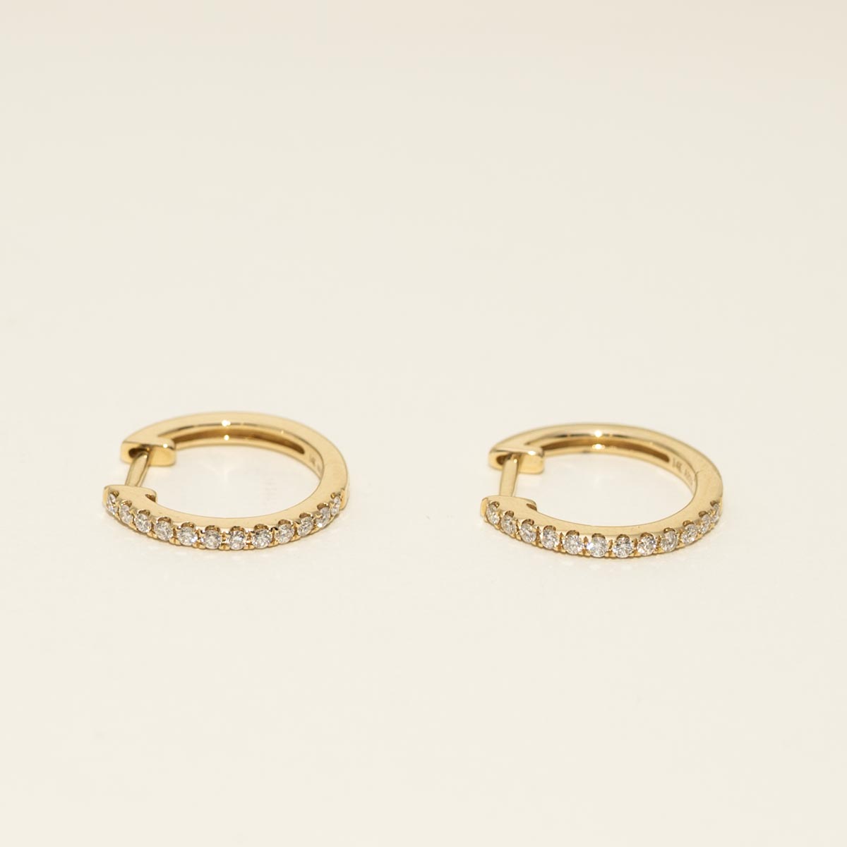 Diamond Huggie Hoop Earrings in 14kt Yellow Gold (1/4ct tw)