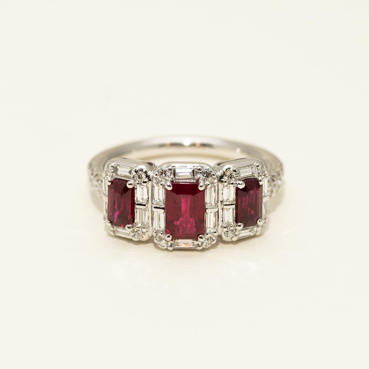 Three Stone Emerald Cut Ruby Halo Ring in 18kt White Gold with Diamonds (5/8ct tw)