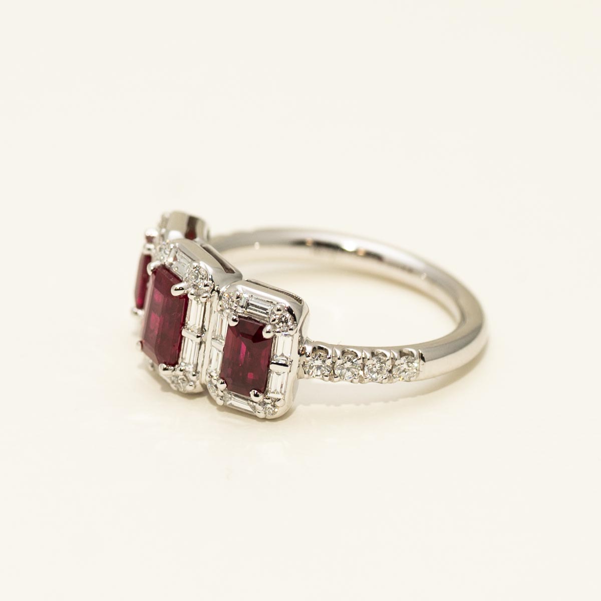 Three Stone Emerald Cut Ruby Halo Ring in 18kt White Gold with Diamonds (5/8ct tw)