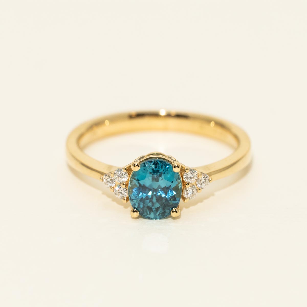 Oval Blue Zircon Ring in 18kt Yellow Gold with Diamonds (1/10ct tw)