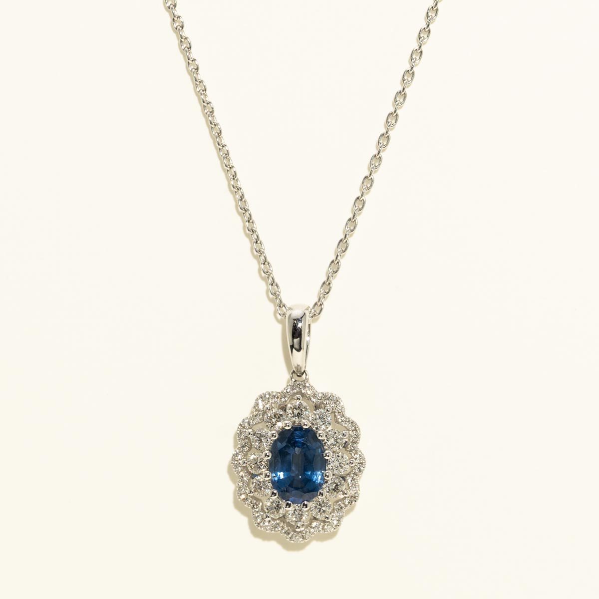 Oval Sapphire Halo Necklace in 14kt White Gold with Diamonds