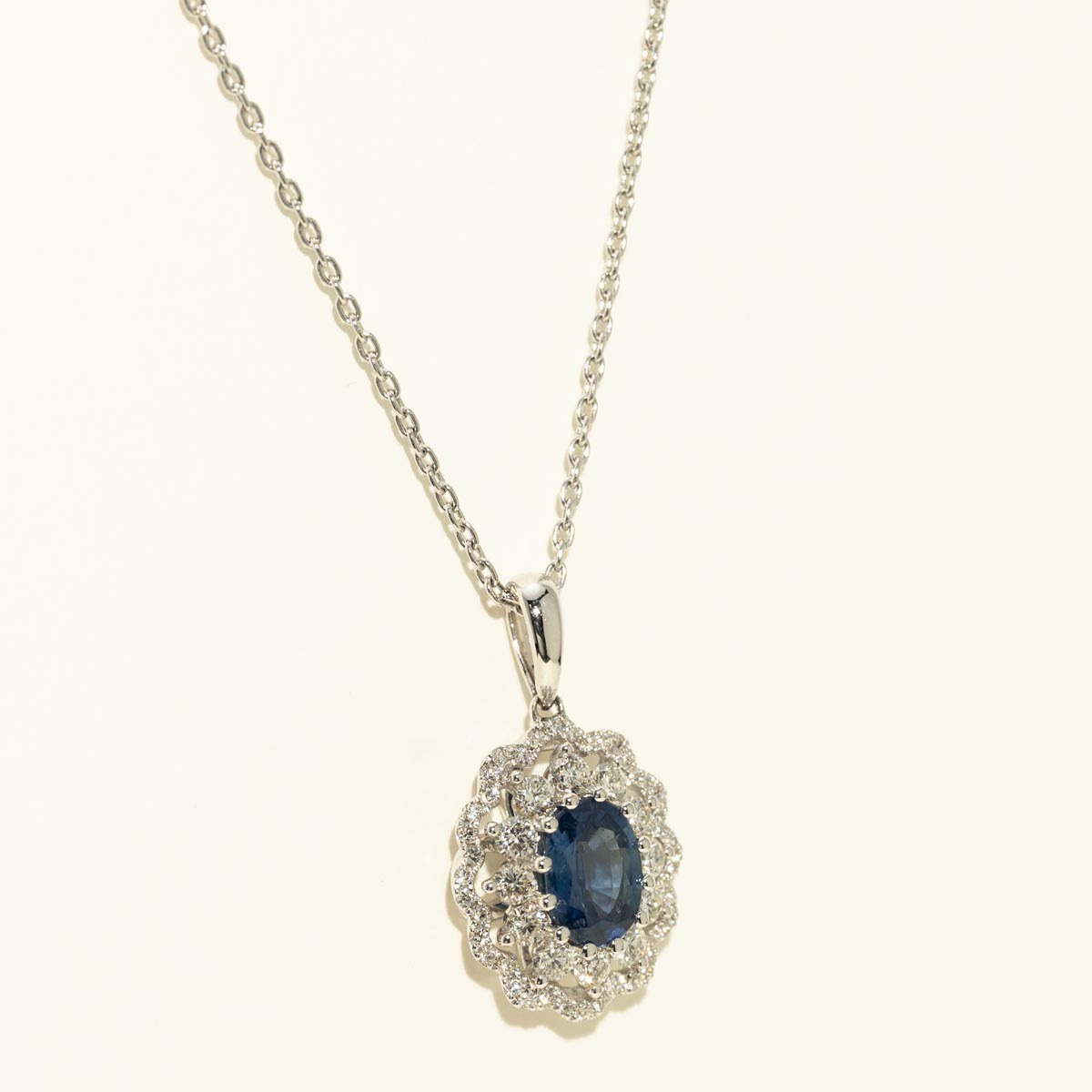 Oval Sapphire Halo Necklace in 14kt White Gold with Diamonds