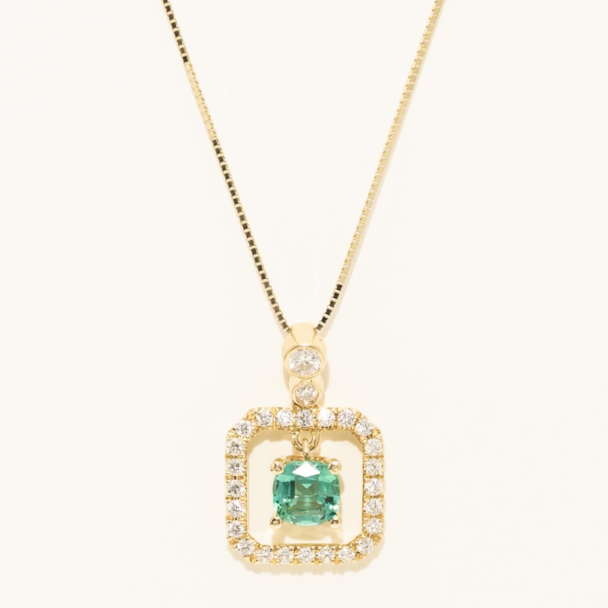Cushion Cut Emerald Halo Necklace in 14kt Yellow Gold with Diamonds