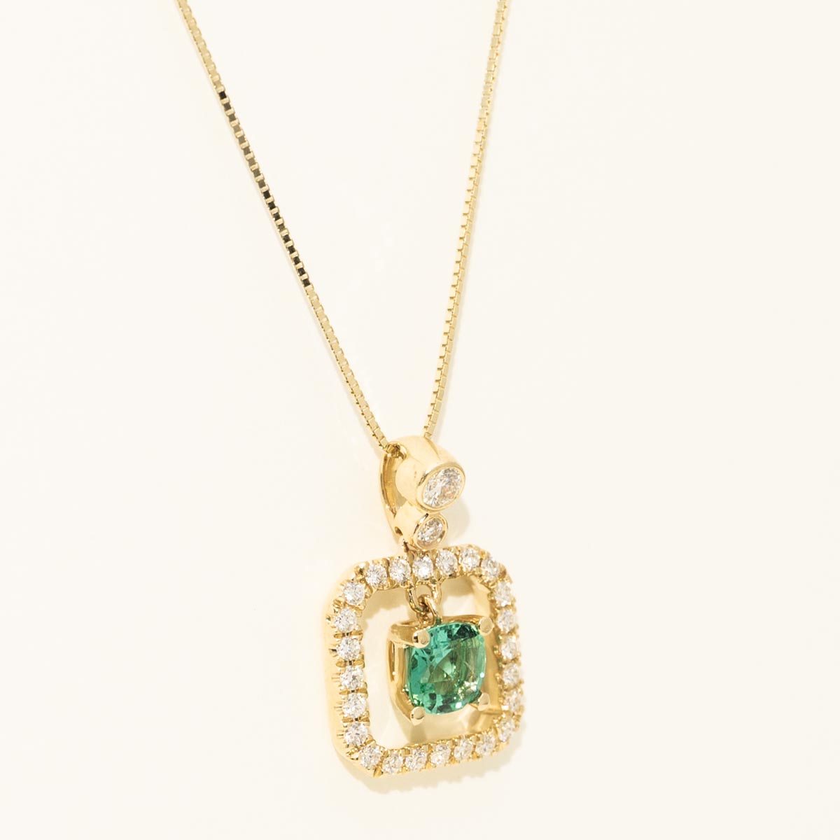 Cushion Cut Emerald Halo Necklace in 14kt Yellow Gold with Diamonds