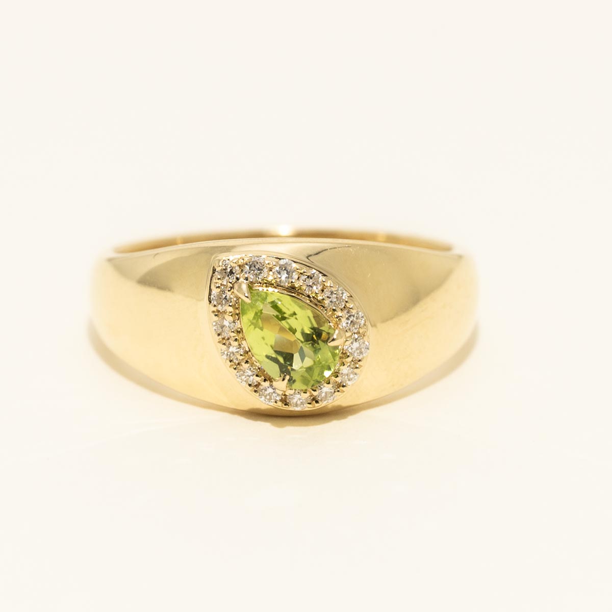 Pear Shape Peridot Halo Ring in 10kt Yellow Gold with Diamonds