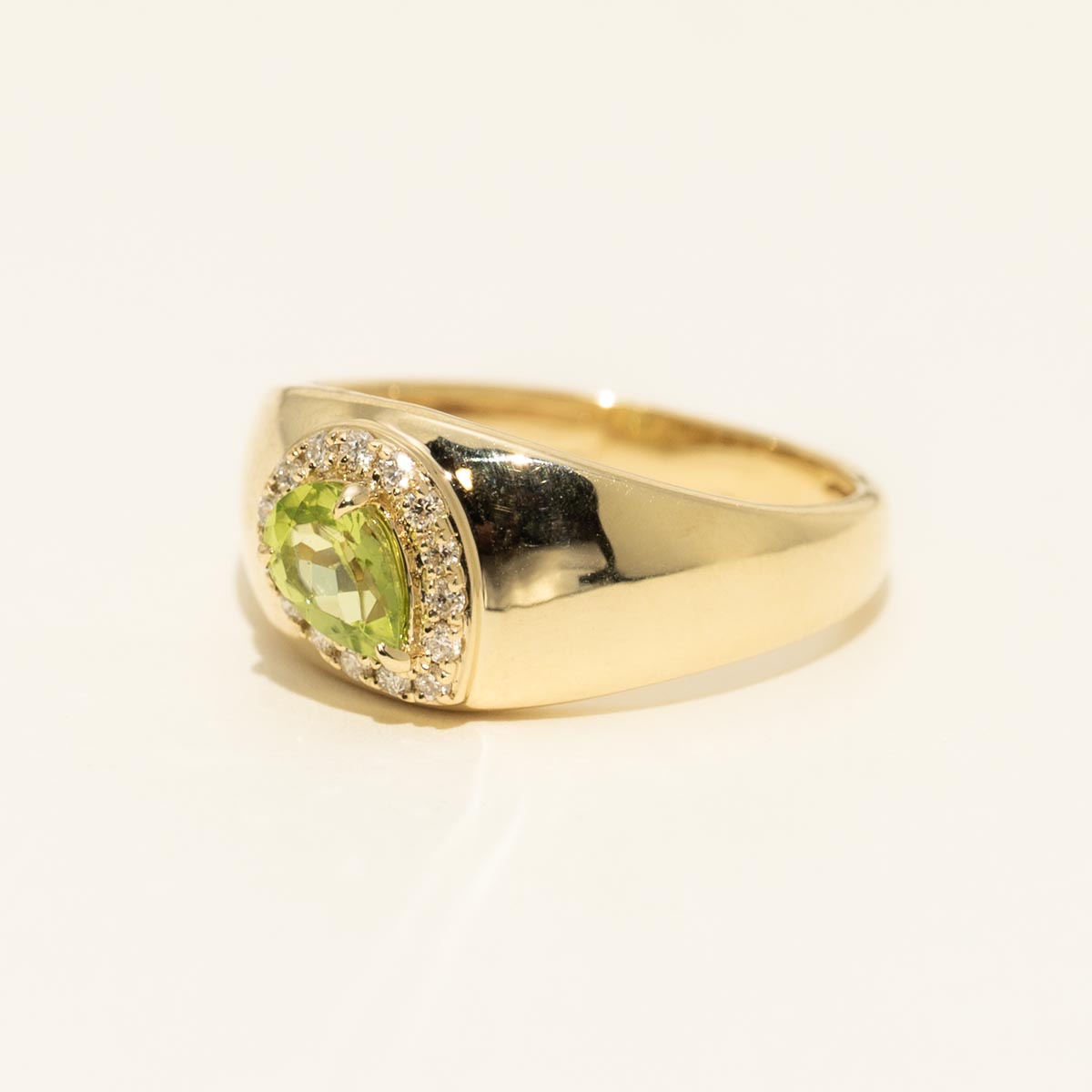 Pear Shape Peridot Halo Ring in 10kt Yellow Gold with Diamonds