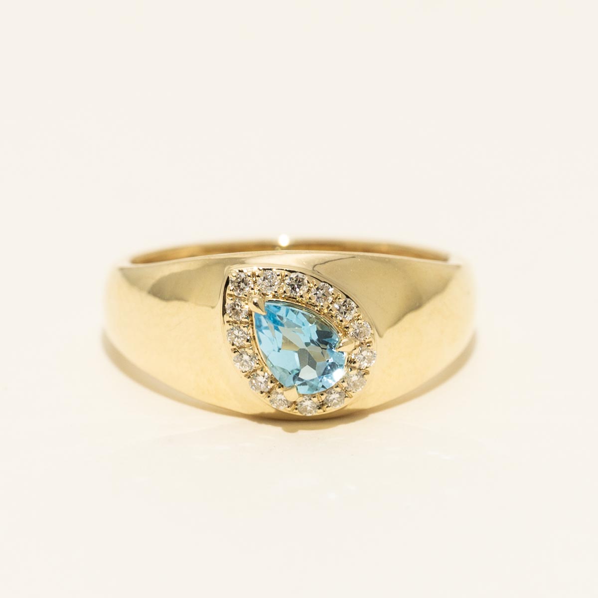 Pear Shaped Blue Topaz Halo Ring in 10kt Yellow Gold with Diamonds
