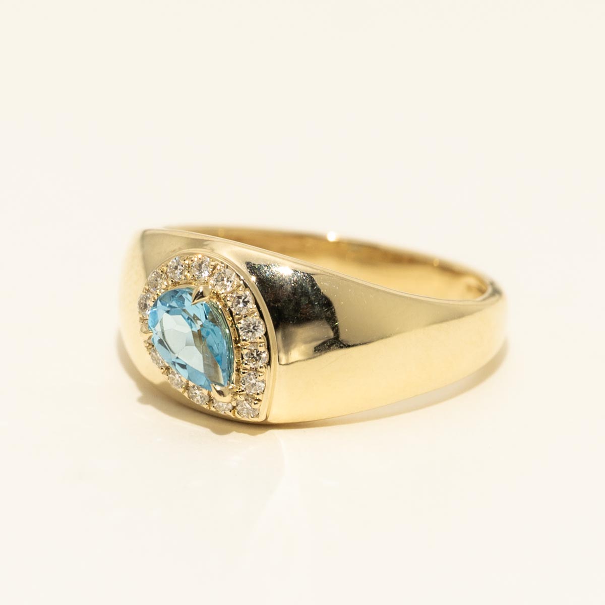 Pear Shaped Blue Topaz Halo Ring in 10kt Yellow Gold with Diamonds