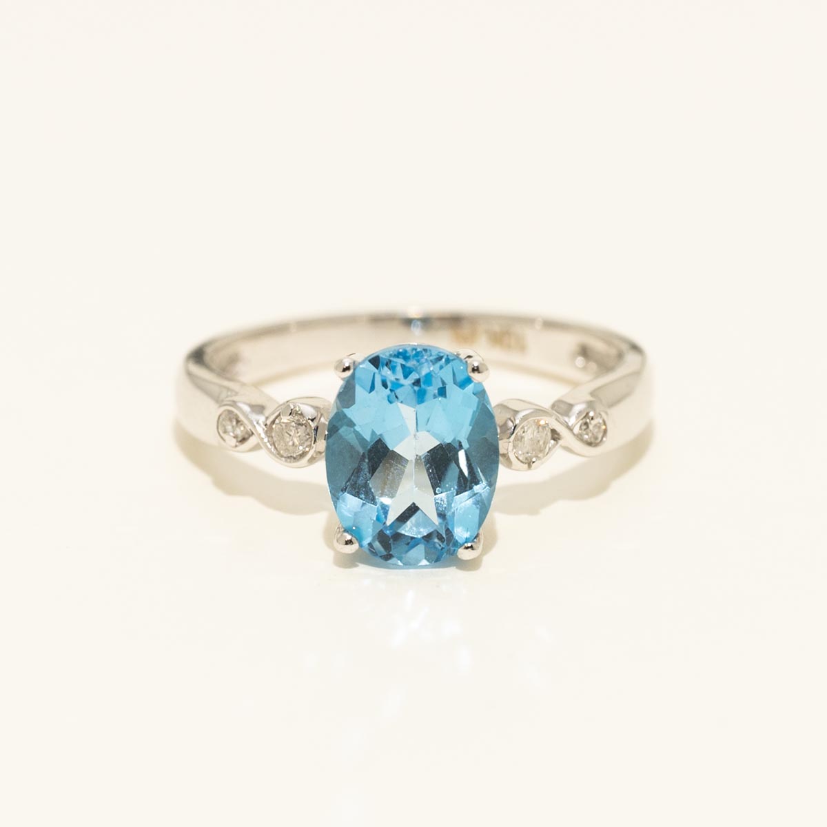 Oval Blue Topaz Ring in 10kt White Gold with Diamonds