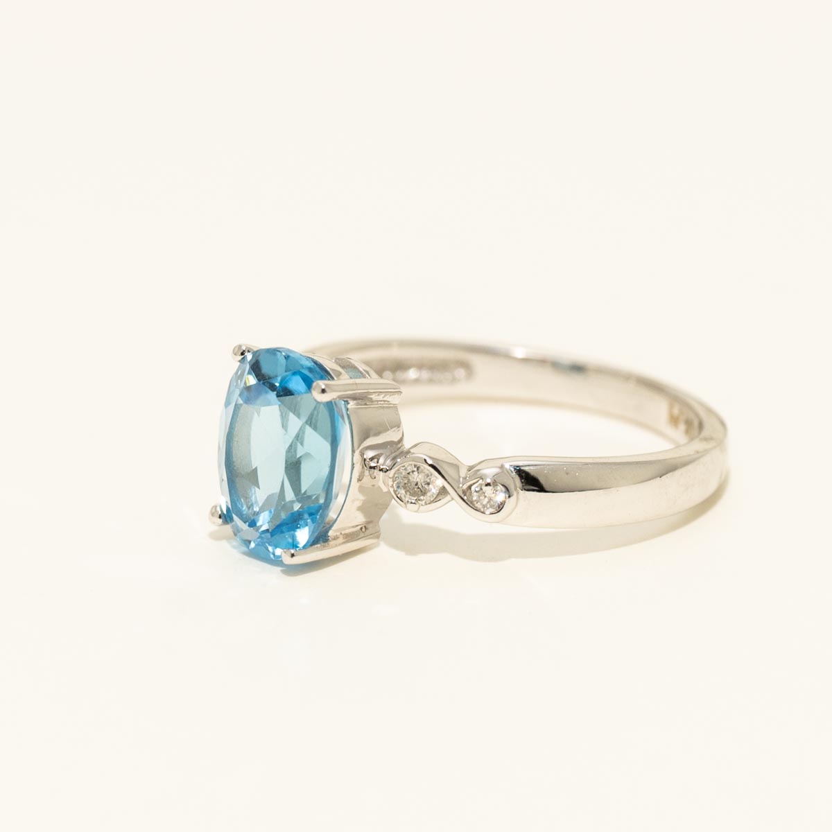 Oval Blue Topaz Ring in 10kt White Gold with Diamonds