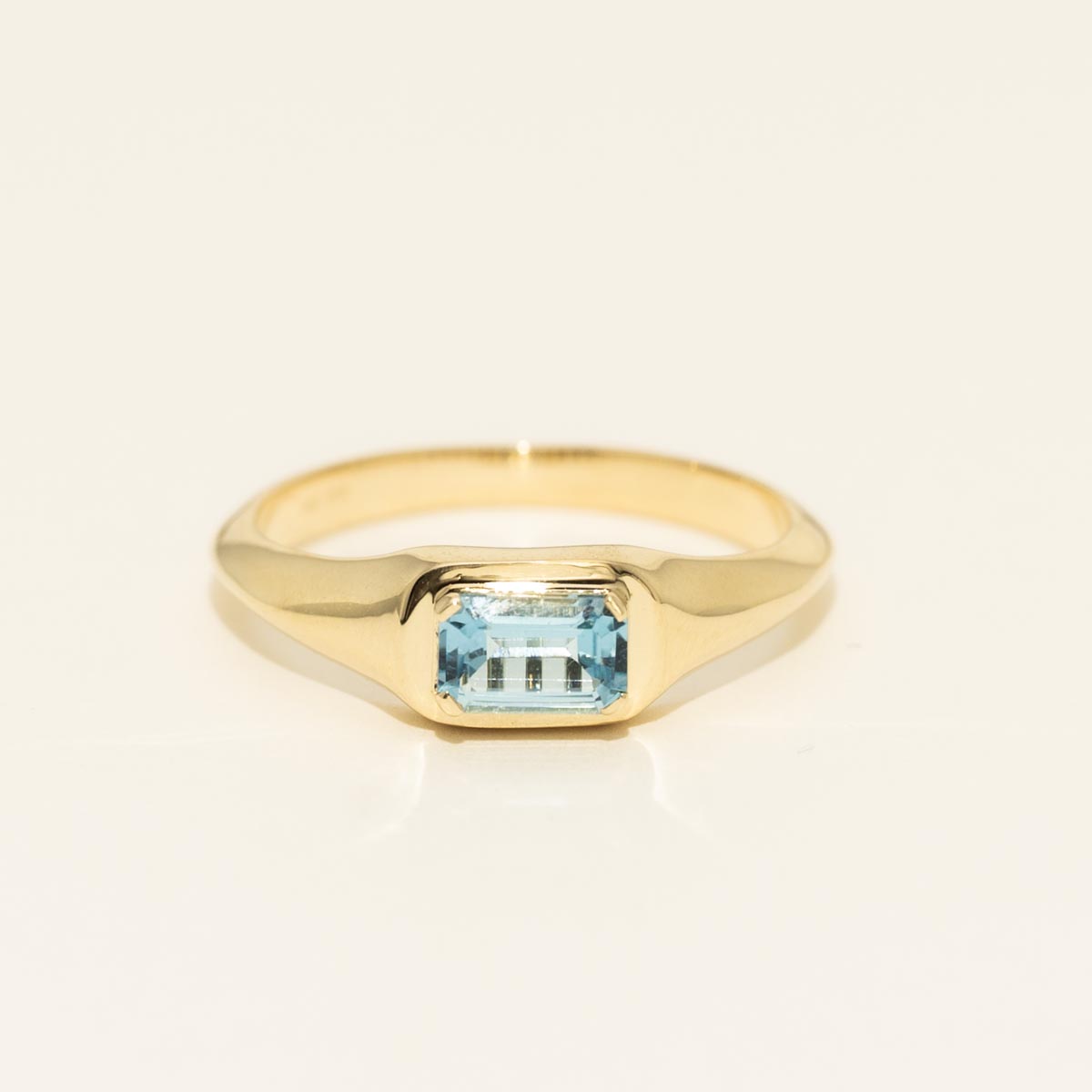 Emerald Cut Blue Topaz Ring in 10kt Yellow Gold