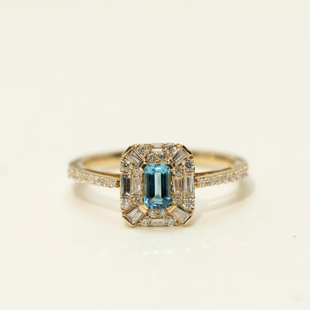 Emerald Cut Blue Topaz Halo Ring in 10kt Yellow Gold with Diamonds