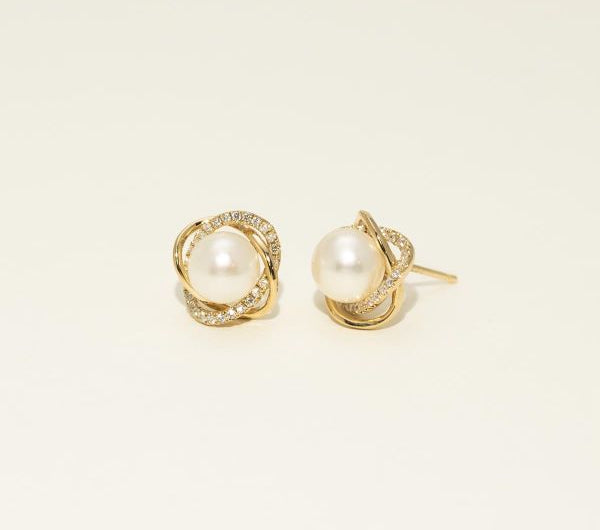 pearls on stud earrings surrounded by diamonds