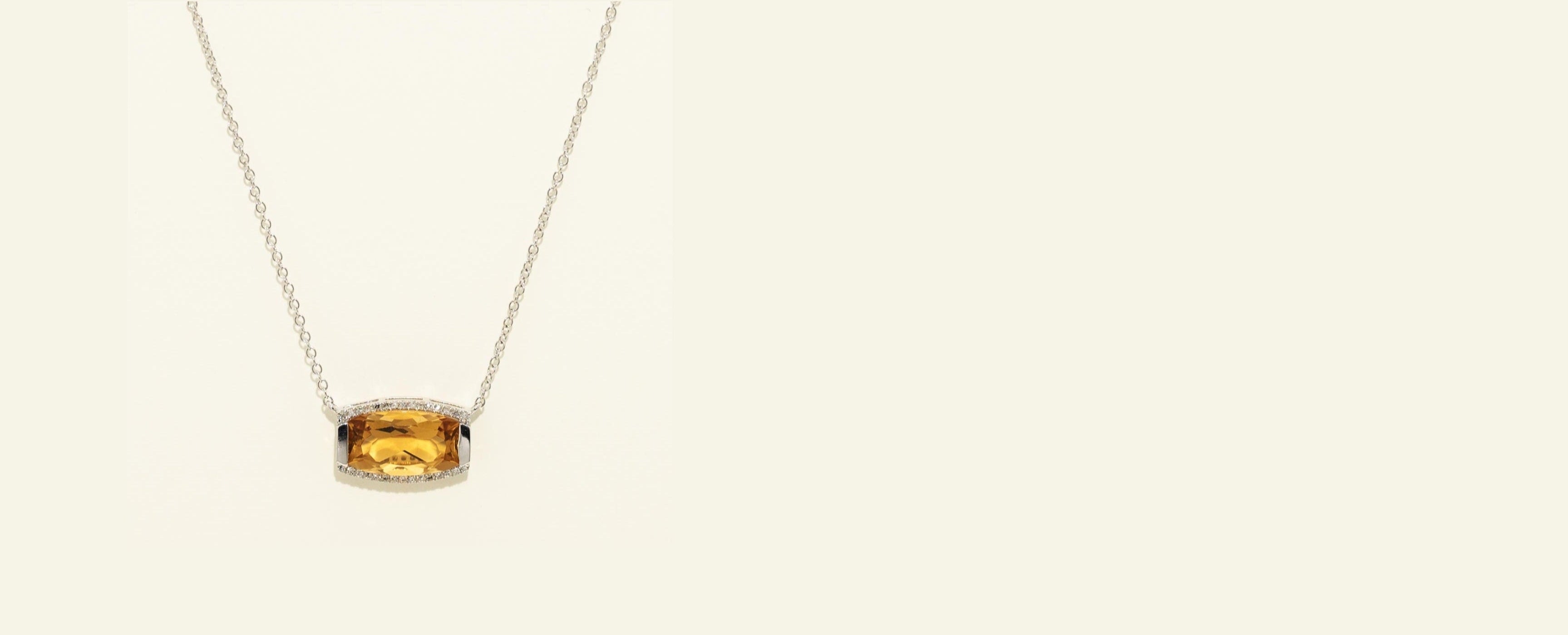 Necklace with a round pendant on a beige background