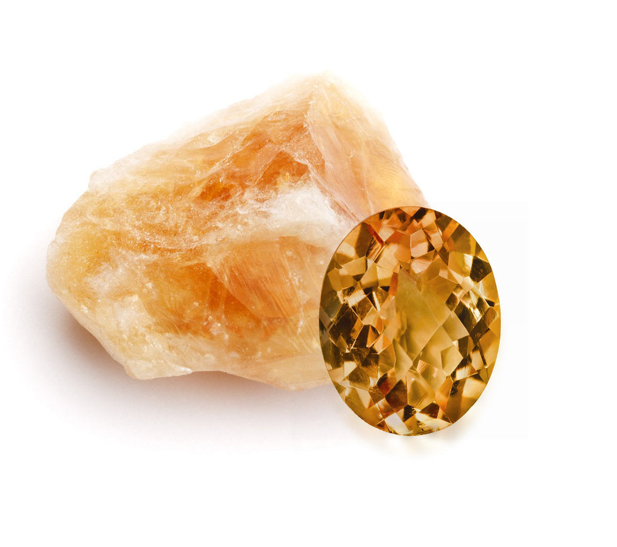 Yellow gemstone next to a rough stone on a white background