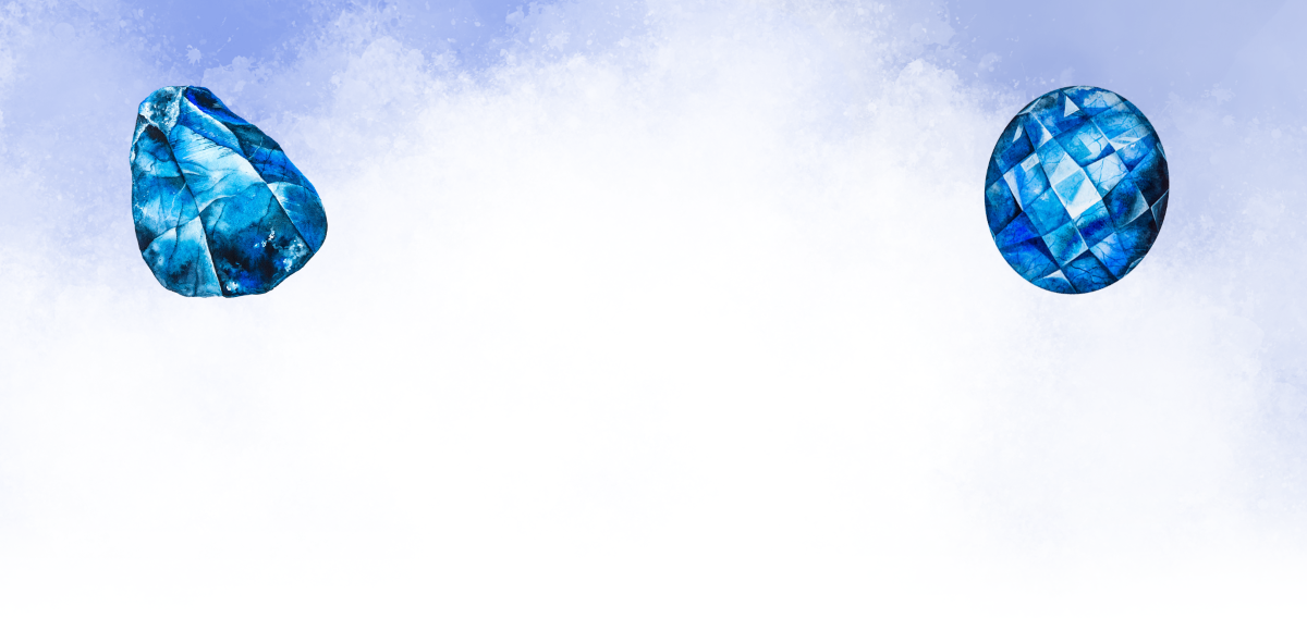 Two blue glass beads against a light blue sky background