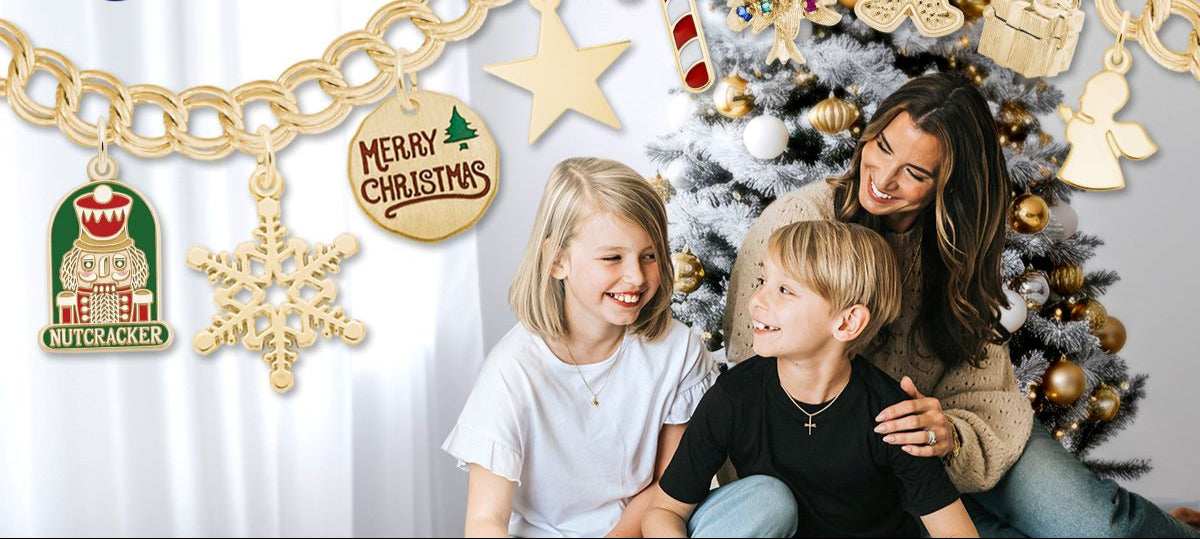 Woman and two children sitting in front of a Christmas tree with Rembrandt Charms displayed.