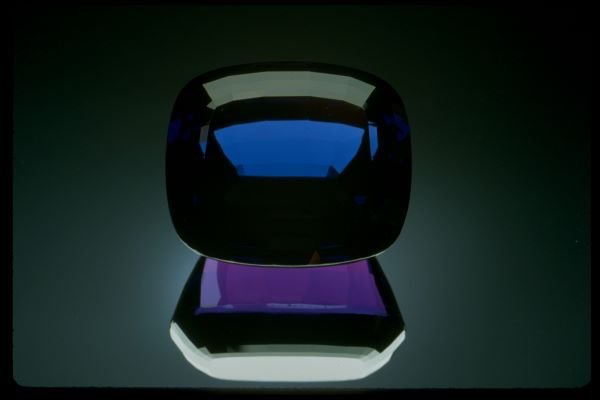 Black and purple gemstone on a dark background