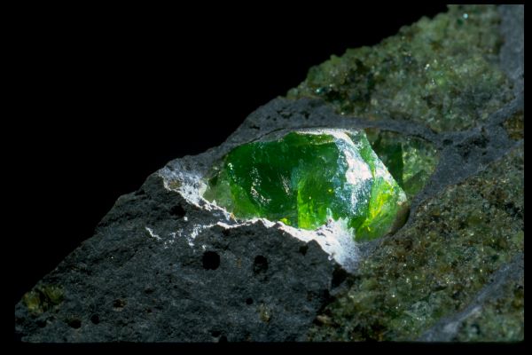 green gem in a rough stone